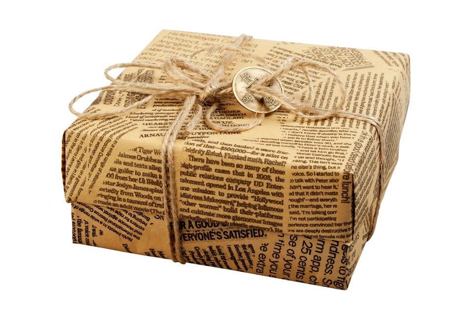 Don't throw away that pile of newspaper because you can use them creatively as wrapping paper.